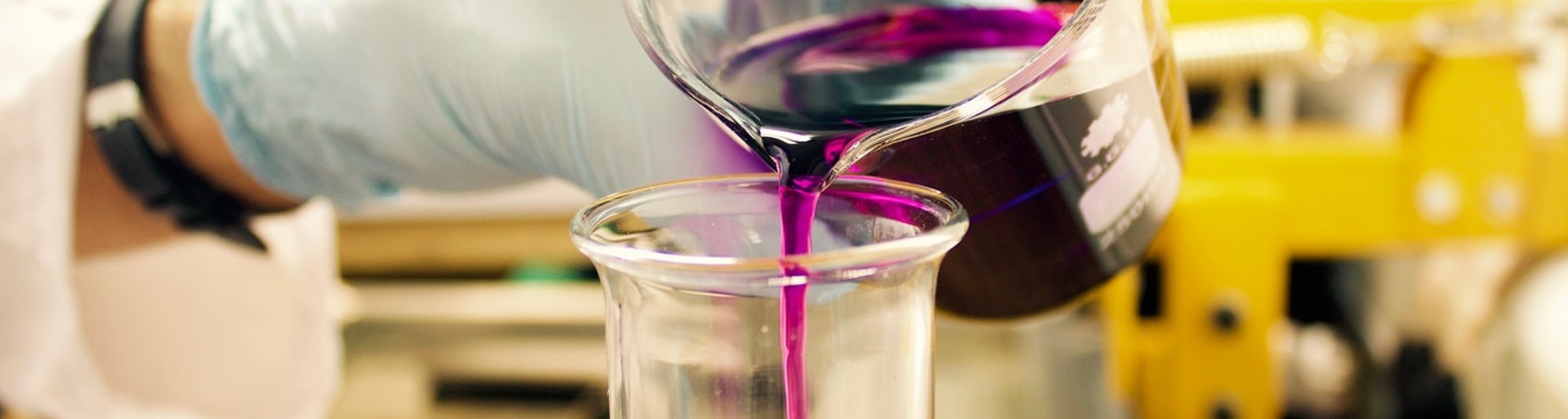 Chemist with a purple liquid 